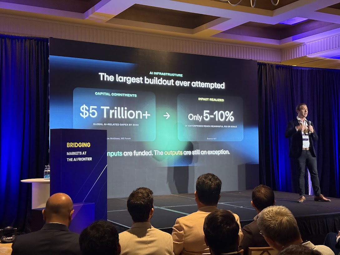 Speaker on stage at the Frontier Leaders Forum with a slide showing $5 trillion plus in global AI-related capex by 2030